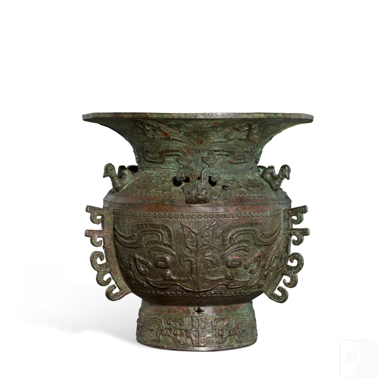 A bronze archaistic 'mask' vessel, zun, Ming dynasty or earlier | 明或更早 青銅仿古獸面紋出戟尊